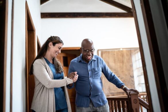 Caregiver helping Consumer walk