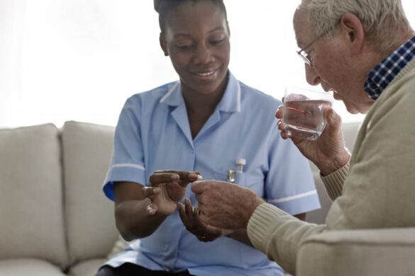 Caregiver assisting client with medication