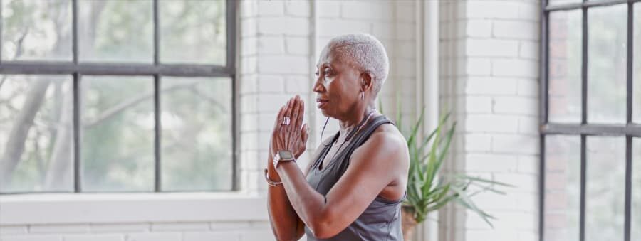 A person uses a yoga pose to improve balance